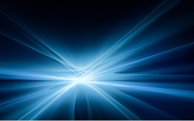 Bright white and blue light emanating rays in various directions against a dark background.