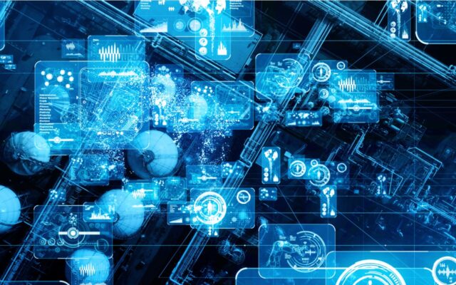 Digitally generated image representing 5G communications network at a modern manufacturing plant, tinted in lighter and darker shades of blue.
