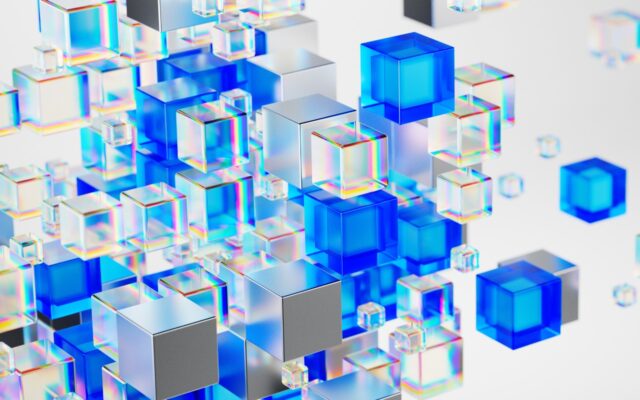 Digital image of silver, gray, white, and blue cubes appearing against a white background.