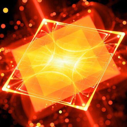 Digital rendering of an orange colored processor with red outlines against a dark background, representative of futuristic quantum computing.