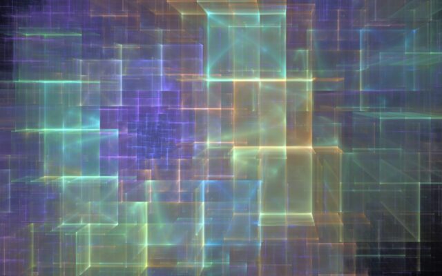 Digitally generated image of cube shapes in green, soft yellow, and purple hues against a darker background.