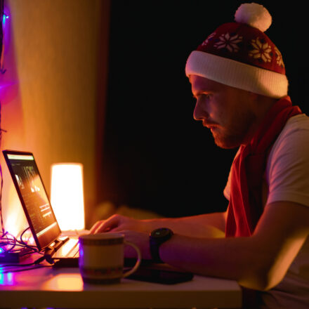 holiday freelancer working in laptop at the home. Nice color light in the room. Soon happy New year. holiday it support
