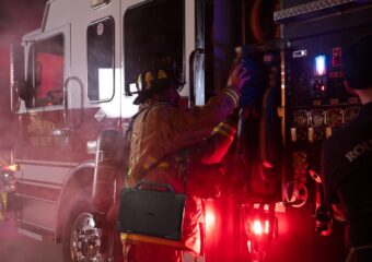 Dell Pro Rugged Laptop model ra13250 on firefighter, with Rugged strap.