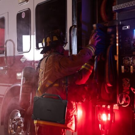 Dell Pro Rugged Laptop model ra13250 on firefighter, with Rugged strap.