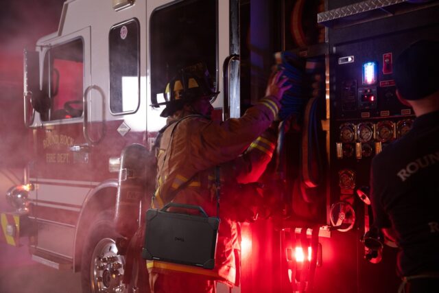Dell Pro Rugged Laptop model ra13250 on firefighter, with Rugged strap.