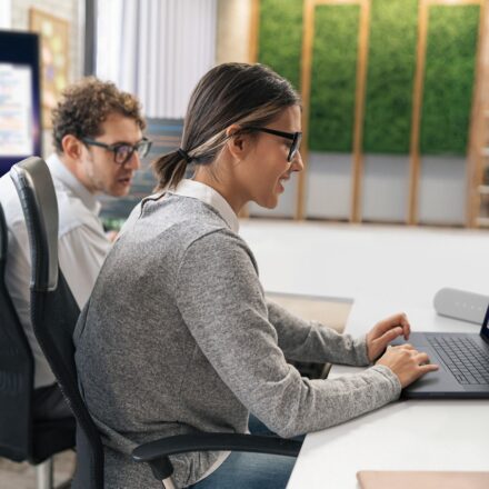 Two designers working in the office on the Dell Pro Max 16 Premium Touch. Image of a screenfill with design software.