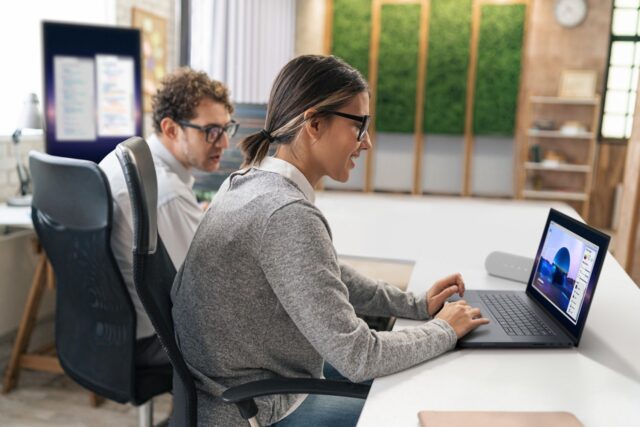 Two designers working in the office on the Dell Pro Max 16 Premium Touch. Image of a screenfill with design software.